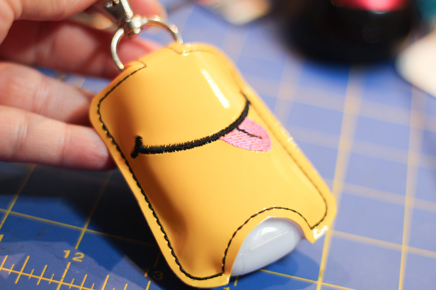 DBB Smiley Face with Tongue Hand Sanitizer Holder Snap Tab Version In the Hoop Embroidery Project 1 oz BBW for 5x7 hoops