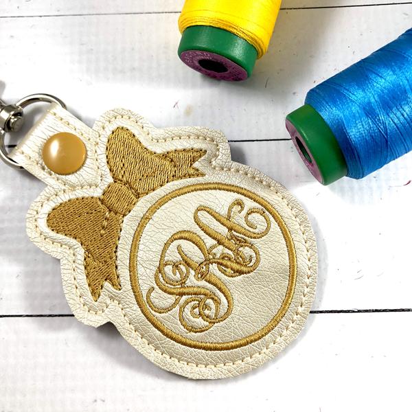 DBB Bow Monogram Snap Tab